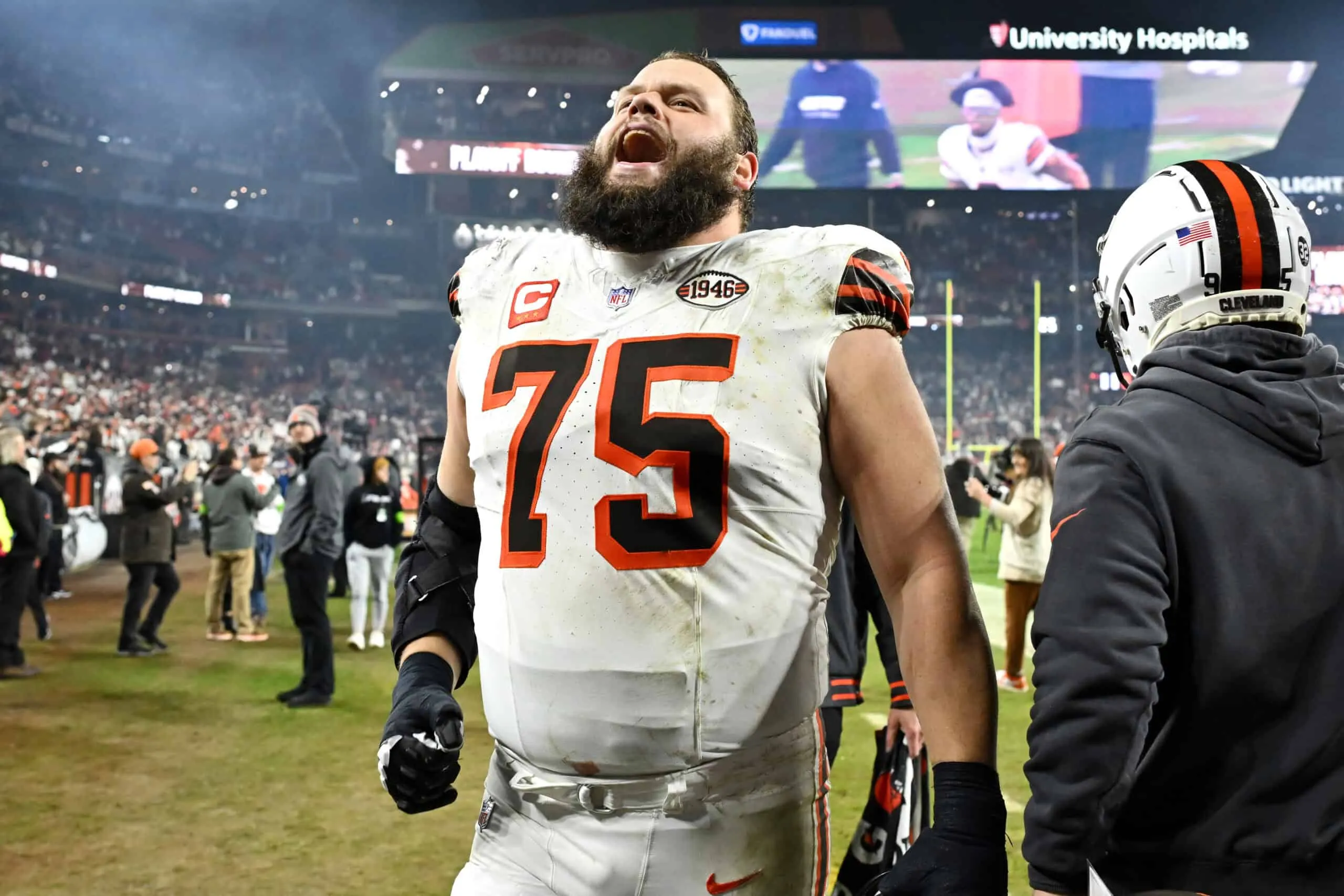 CLEVELAND, OHIO - DECEMBER 28: Joel Bitonio #75 of the Cleveland Browns celebrates after their win against the New York Jets at Cleveland Browns Stadium on December 28, 2023 in Cleveland, Ohio.