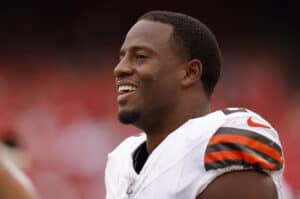 KANSAS CITY, MISSOURI - AUGUST 26: Nick Chubb #24 of the Cleveland Browns smiles during the second quarter on the sidelines of a preseason game against the Kansas City Chiefs at GEHA Field at Arrowhead Stadium on August 26, 2023 in Kansas City, Missouri.