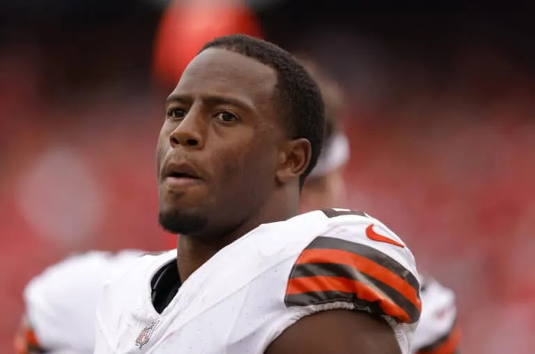 KANSAS CITY, MISSOURI - AUGUST 26: Nick Chubb #24 of the Cleveland Browns smiles during the second quarter on the sidelines of a preseason game against the Kansas City Chiefs at GEHA Field at Arrowhead Stadium on August 26, 2023 in Kansas City, Missouri.