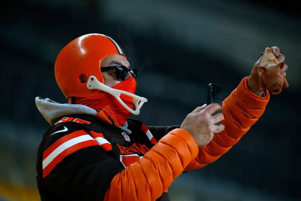 PITTSBURGH, PENNSYLVANIA - JANUARY 10: A fan of the Cleveland Browns celebrates during the AFC Wild Card Playoff game against the Pittsburgh Steelers at Heinz Field on January 10, 2021 in Pittsburgh, Pennsylvania.