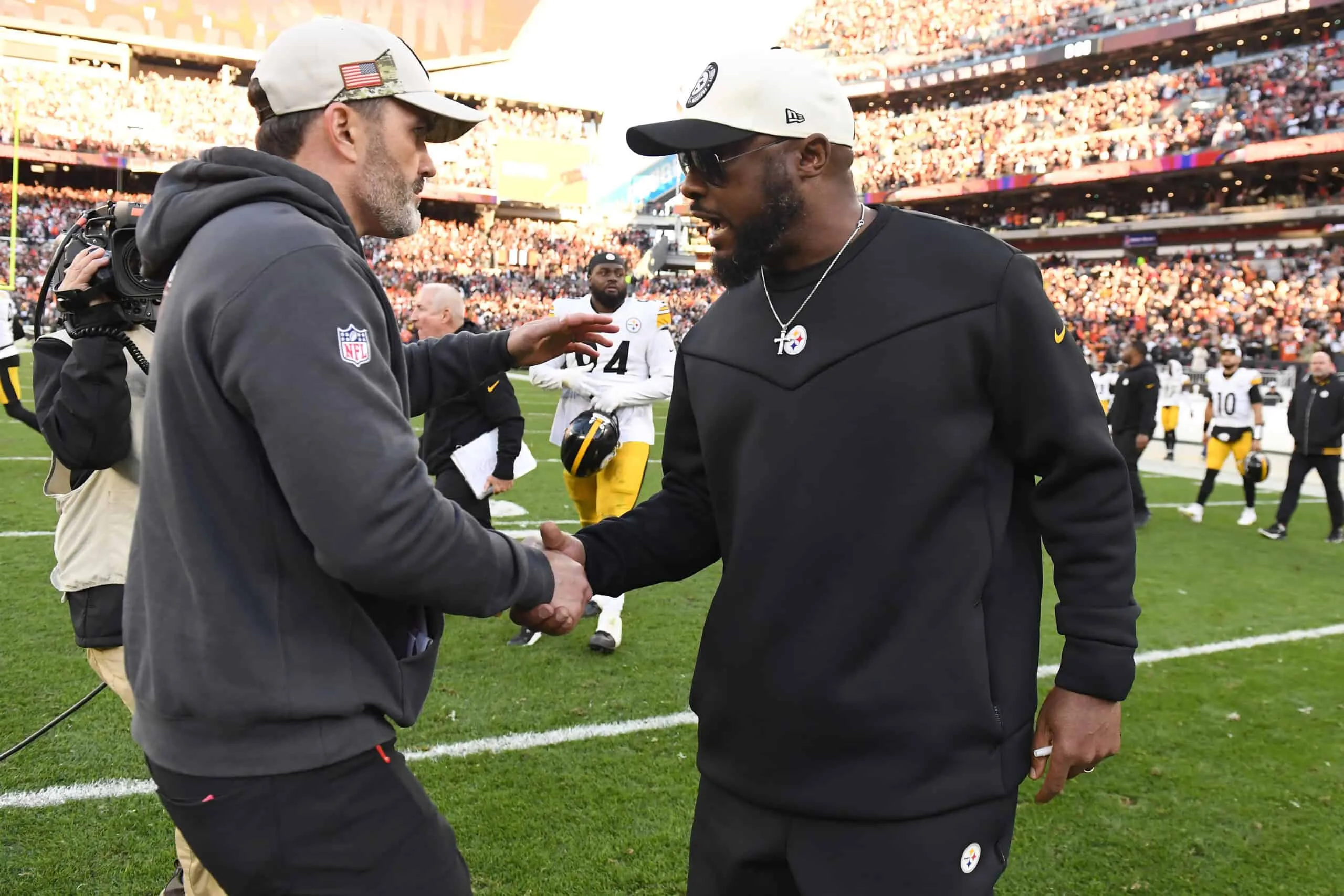 CLEVELAND, OHIO - NOVEMBER 19: Head coach Kevin Stefanski of the Cleveland Browns (L) and head coach Mike Tomlin of the Pittsburgh Steelers meet after the Browns beat the Steelers 13-10 at Cleveland Browns Stadium on November 19, 2023 in Cleveland, Ohio.
