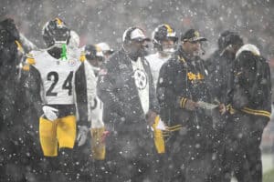 CLEVELAND, OHIO - NOVEMBER 21: Head coach Mike Tomlin of the Pittsburgh Steelers looks on as snow falls against the Cleveland Browns during the fourth quarter in the game at Huntington Bank Field on November 21, 2024 in Cleveland, Ohio.