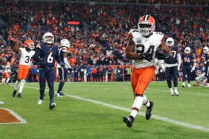 DENVER, COLORADO - DECEMBER 02: Nick Chubb #24 of the Cleveland Browns scores a 5 yard touchdown against the Denver Broncos during the fourth quarter in the game at Empower Field At Mile High on December 02, 2024 in Denver, Colorado.