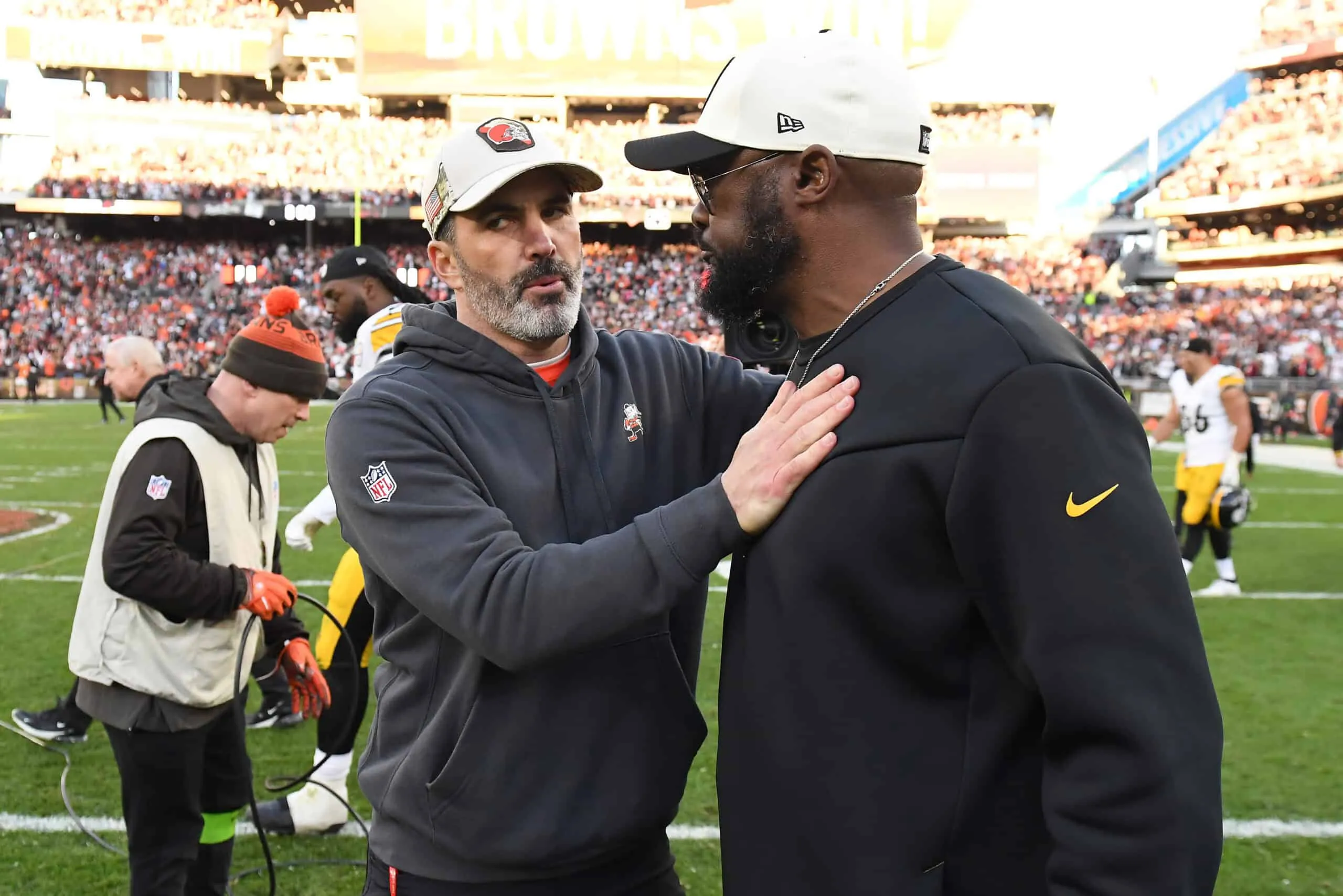 CLEVELAND, OHIO - NOVEMBER 19: Head coach Kevin Stefanski of the Cleveland Browns (L) and head coach Mike Tomlin of the Pittsburgh Steelers meet after the Browns beat the Steelers 13-10 at Cleveland Browns Stadium on November 19, 2023 in Cleveland, Ohio.