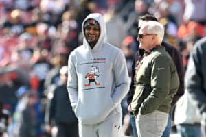 CLEVELAND, OHIO - NOVEMBER 19: Deshaun Watson #4 of the Cleveland Browns meets with owner Jimmy Haslam before the game against the Pittsburgh Steelers at Cleveland Browns Stadium on November 19, 2023 in Cleveland, Ohio.