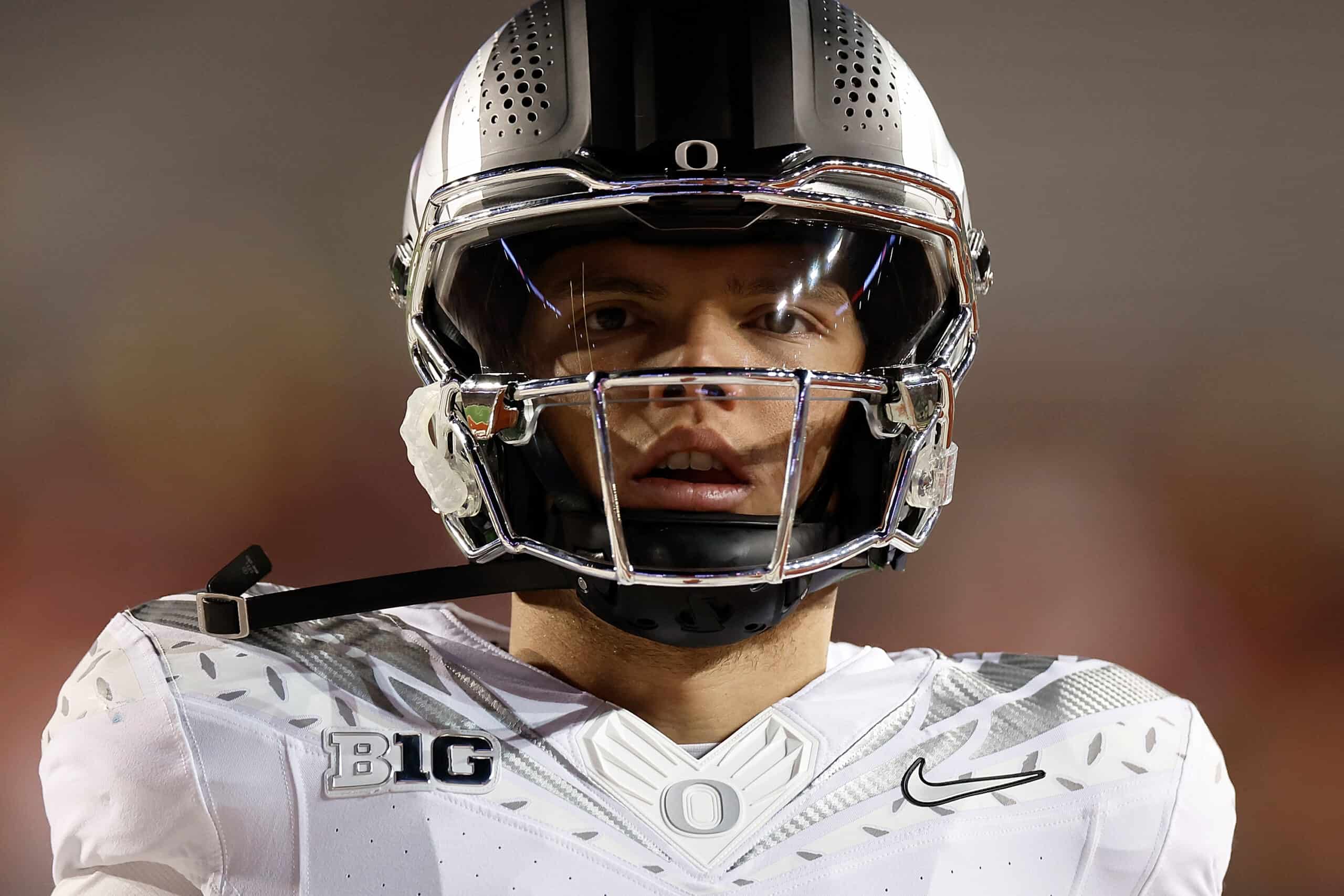 MADISON, WISCONSIN - NOVEMBER 16: Dillon Gabriel #8 of the Oregon Ducks warms up before the game against the Wisconsin Badgers at Camp Randall Stadium on November 16, 2024 in Madison, Wisconsin.