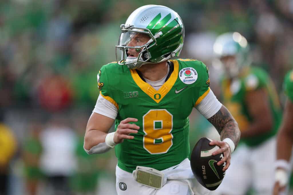 PASADENA, CALIFORNIA - JANUARY 01: Dillon Gabriel #8 of the Oregon Ducks scrambles with the ball during the Rose Bowl game against the Ohio State Buckeyes at Rose Bowl Stadium on January 01, 2025 in Pasadena, California.
