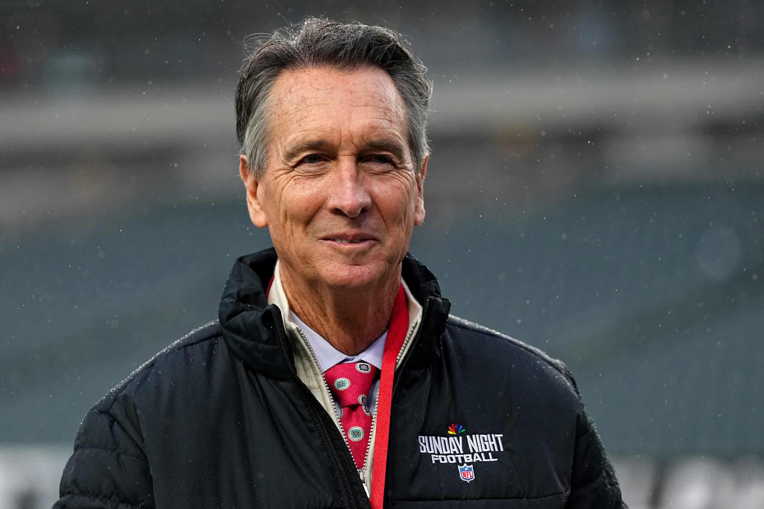 PHILADELPHIA, PENNSYLVANIA - JANUARY 19: NBC Broadcaster Cris Collinsworth looks on before the game between the Philadelphia Eagles and the Los Angeles Rams during the NFC Divisional Playoff at Lincoln Financial Field on January 19, 2025 in Philadelphia, Pennsylvania.