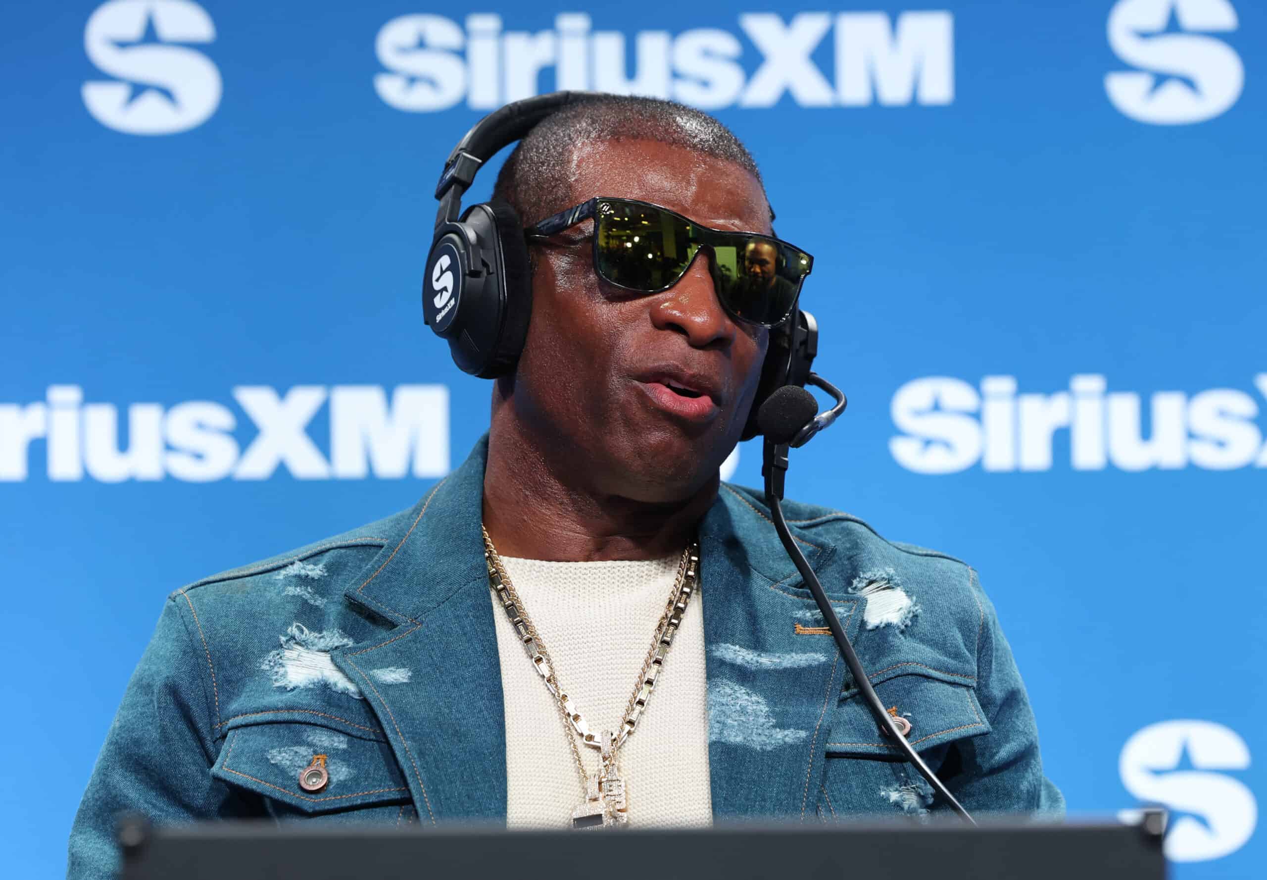 NEW ORLEANS, LOUISIANA - FEBRUARY 07: Deion Sanders speaks on SiriusXM on radio row at Super Bowl LIX on February 07, 2025 in New Orleans, Louisiana.