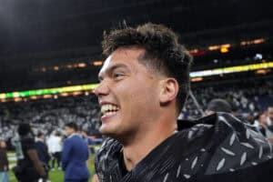 INDIANAPOLIS, INDIANA - DECEMBER 07: Dillon Gabriel #8 of the Oregon Ducks celebrates after the team's 45-37 win against the Penn State Nittany Lions in the 2024 Big Ten Football Championship at Lucas Oil Stadium on December 07, 2024 in Indianapolis, Indiana.