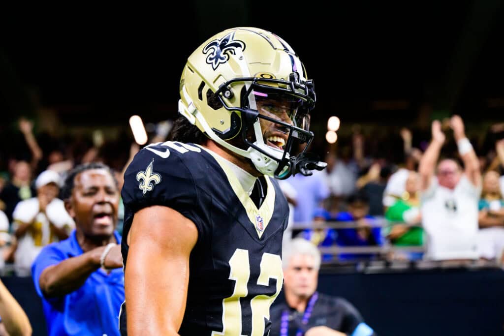 NEW ORLEANS, LOUISIANA - SEPTEMBER 22: Chris Olave #12 of the New Orleans Saints celebrates a touchdown reception against the Philadelphia Eagles during the fourth quarter at Caesars Superdome on September 22, 2024 in New Orleans, Louisiana.