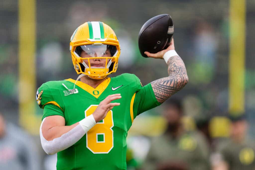 EUGENE, OREGON - NOVEMBER 9: Quarterback Dillon Gabriel #8 of the Oregon Ducks warms up before the game against the Maryland Terrapins at Autzen Stadium on November 9, 2024 in Eugene, Oregon.