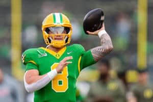 EUGENE, OREGON - NOVEMBER 9: Quarterback Dillon Gabriel #8 of the Oregon Ducks warms up before the game against the Maryland Terrapins at Autzen Stadium on November 9, 2024 in Eugene, Oregon.