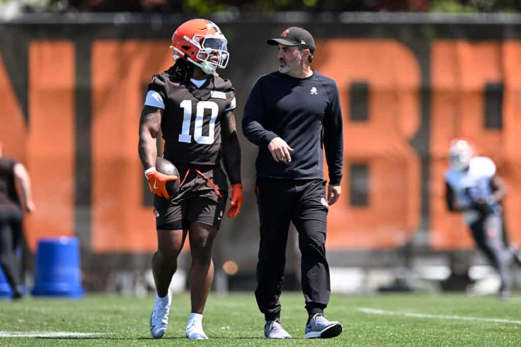 BEREA, OHIO - MAY 10: Head coach Kevin Stefanski of the Cleveland Browns instructs Quinshon Judkins #10 during rookie minicamp at CrossCountry Mortgage Campus on May 10, 2025 in Berea, Ohio.