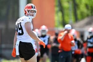 BEREA, OHIO - MAY 10: Carson Schwesinger #49 of the Cleveland Browns looks on during rookie minicamp at CrossCountry Mortgage Campus on May 10, 2025 in Berea, Ohio.
