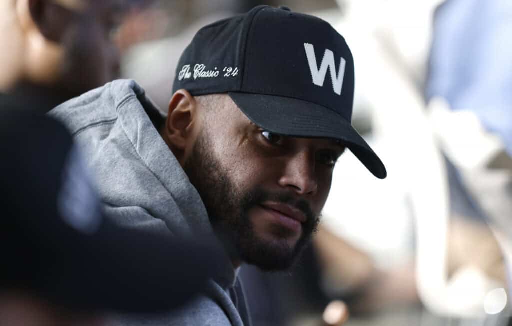 FRISCO, TEXAS - JANUARY 27: Dallas Cowboys quarterback Dak Prescott #4 looks on from the audience as Brian Schottenheimer is introduced as the new head coach of the Dallas Cowboys at The Star in Frisco on January 27, 2025 in Frisco, Texas.