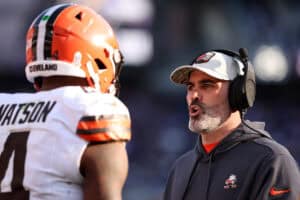 BALTIMORE, MARYLAND - NOVEMBER 12: Head coach Kevin Stefanski of the Cleveland Browns speaks to Deshaun Watson #4 during the second half against the Baltimore Ravens at M&T Bank Stadium on November 12, 2023 in Baltimore, Maryland.
