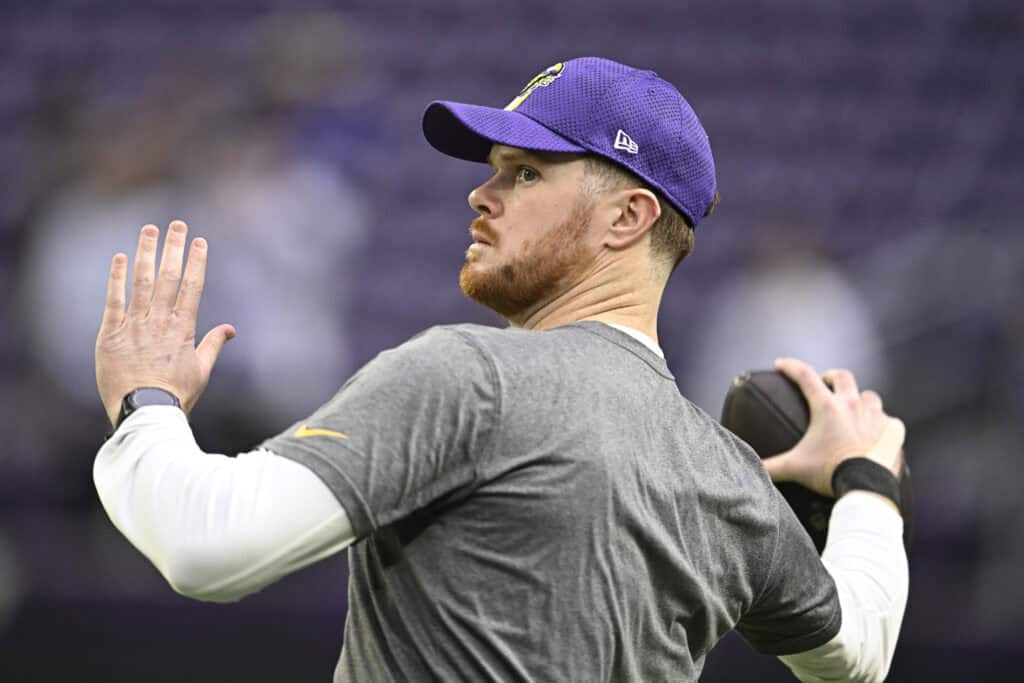 MINNEAPOLIS, MINNESOTA - DECEMBER 29: Sam Darnold #14 of the Minnesota Vikings warms up prior to a game against the Green Bay Packers at U.S. Bank Stadium on December 29, 2024 in Minneapolis, Minnesota.
