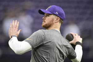 MINNEAPOLIS, MINNESOTA - DECEMBER 29: Sam Darnold #14 of the Minnesota Vikings warms up prior to a game against the Green Bay Packers at U.S. Bank Stadium on December 29, 2024 in Minneapolis, Minnesota.