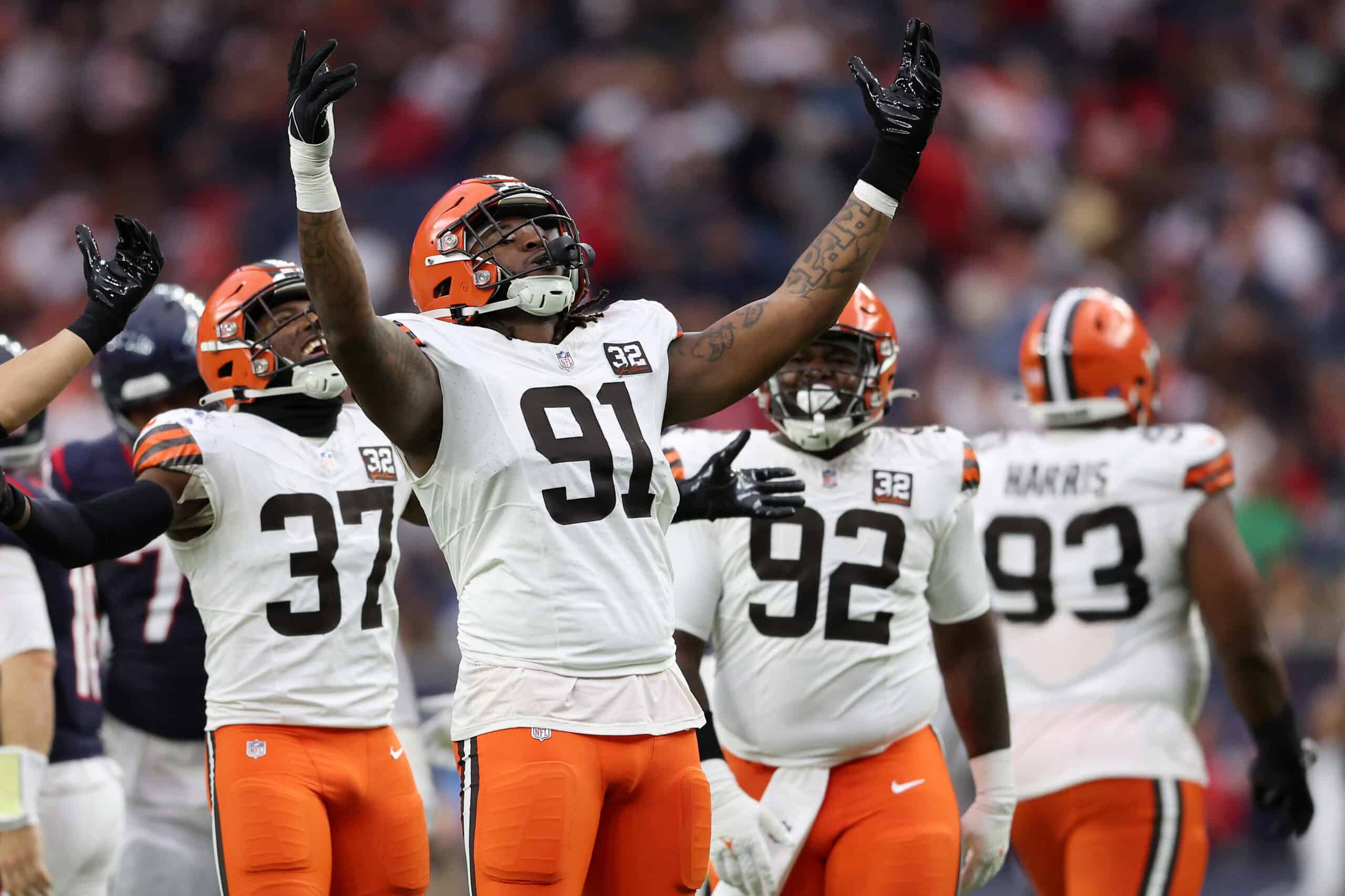 HOUSTON, TEXAS - DECEMBER 24: Alex Wright #91 of the Cleveland Browns celebrates after sacking Case Keenum of the Houston Texans during the second quarter at NRG Stadium on December 24, 2023 in Houston, Texas.