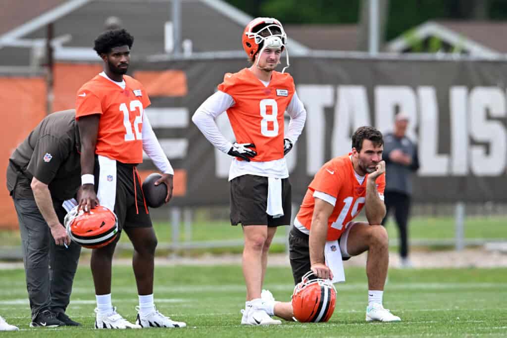 BEREA, OHIO - JUNE 04: (L-R) Shedeur Sanders #12, Kenny Pickett #8 and Joe Flacco #15 of the Cleveland Browns watch a drill during Cleveland Browns OTA offseason workouts at CrossCountry Mortgage Campus on June 04, 2025 in Berea, Ohio.