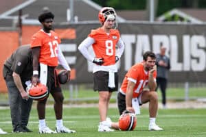 BEREA, OHIO - JUNE 04: (L-R) Shedeur Sanders #12, Kenny Pickett #8 and Joe Flacco #15 of the Cleveland Browns watch a drill during Cleveland Browns OTA offseason workouts at CrossCountry Mortgage Campus on June 04, 2025 in Berea, Ohio.