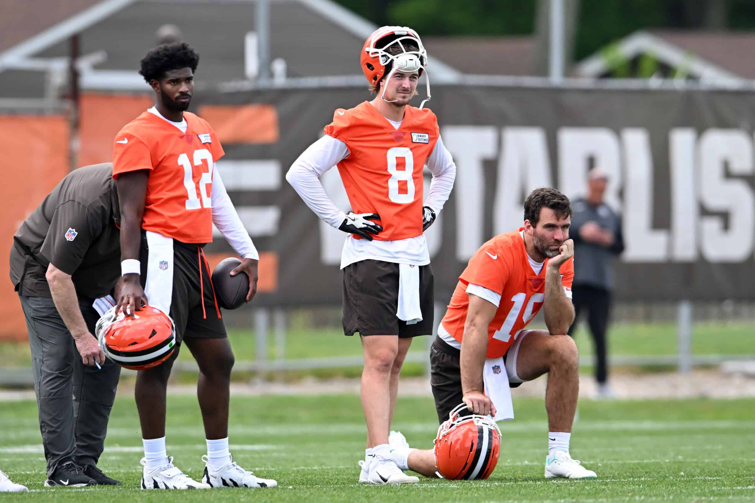 BEREA, OHIO - JUNE 04: (L-R) Shedeur Sanders #12, Kenny Pickett #8 and Joe Flacco #15 of the Cleveland Browns watch a drill during Cleveland Browns OTA offseason workouts at CrossCountry Mortgage Campus on June 04, 2025 in Berea, Ohio.