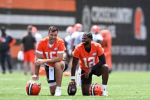 BEREA, OHIO - JUNE 10: Joe Flacco #15 and Shedeur Sanders #12 of the Cleveland Browns laugh during Cleveland Browns mandatory minicamp at CrossCountry Mortgage Campus on June 10, 2025 in Berea, Ohio.