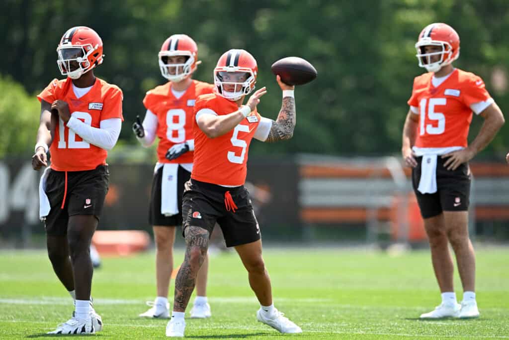 BEREA, OHIO - JUNE 11: Dillon Gabriel #5 of the Cleveland Browns throws a pass as Shedeur Sanders #12, Kenny Pickett #8 and Joe Flacco #15 look on during Cleveland Browns mandatory minicamp at CrossCountry Mortgage Campus on June 11, 2025 in Berea, Ohio.