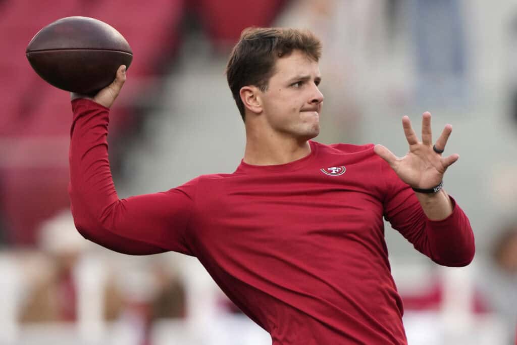 SANTA CLARA, CALIFORNIA - DECEMBER 30: Brock Purdy #13 of the San Francisco 49ers warms up before the game against the Detroit Lions at Levi's Stadium on December 30, 2024 in Santa Clara, California.