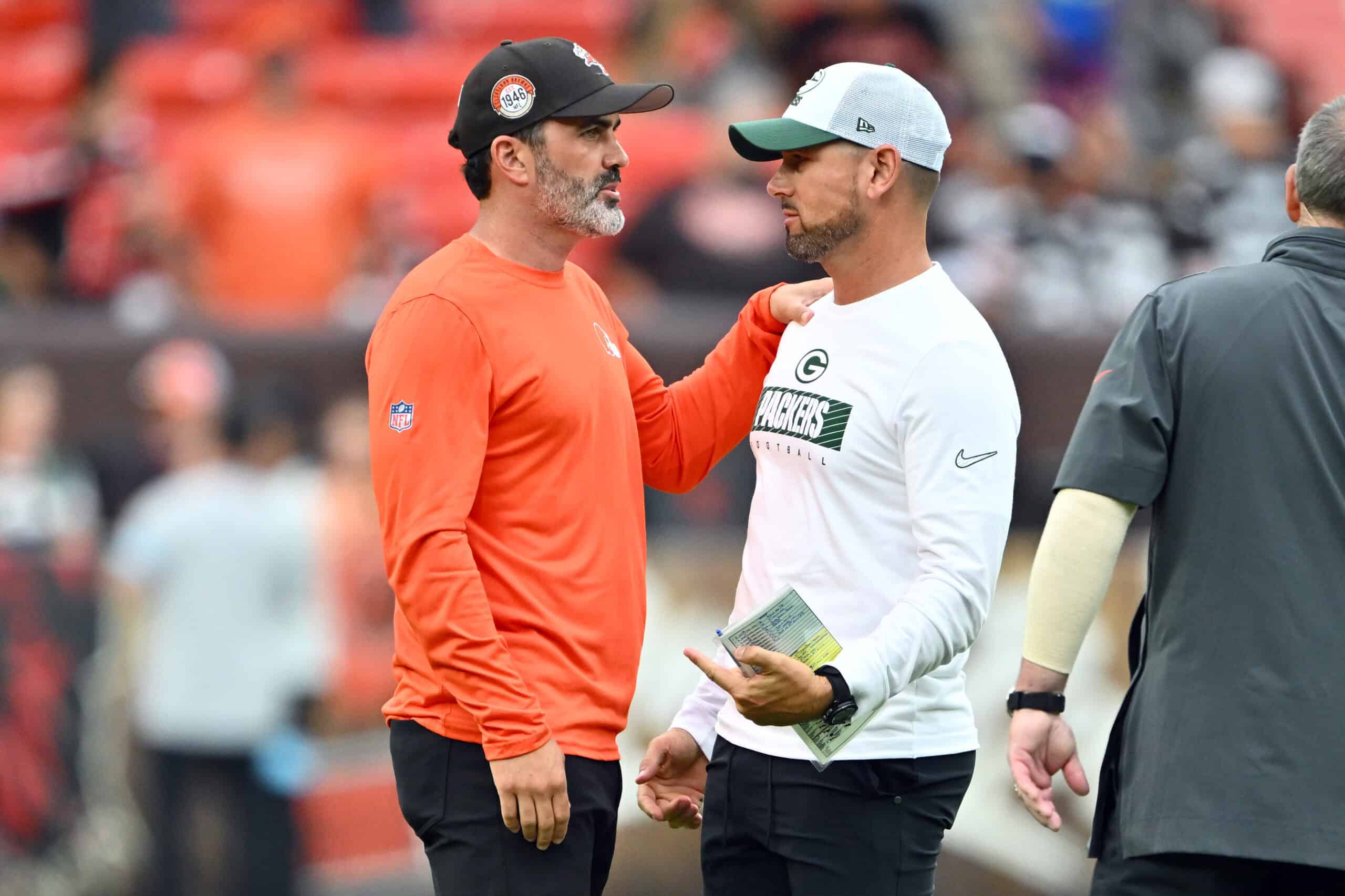 CLEVELAND, OHIO - AUGUST 10: Head coaches Kevin Stefanski of the Cleveland Browns and Matt LaFleur of the Green Bay Packers talk after a preseason game at Cleveland Browns Stadium on August 10, 2024 in Cleveland, Ohio. The Packers defeated the Browns 23-10.