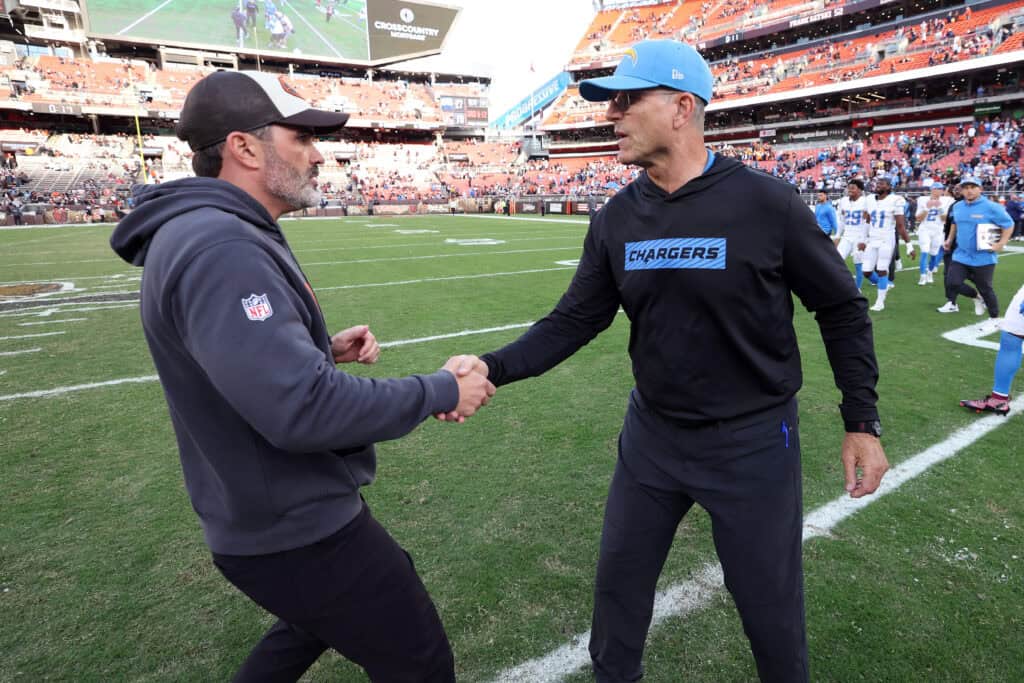 CLEVELAND, OHIO - NOVEMBER 03: Head coach Kevin Stefanski of the Cleveland Browns and head coach Jim Harbaugh of the Los Angeles Chargers shake hands after Los Angeles' 27-10 win at Huntington Bank Field on November 03, 2024 in Cleveland, Ohio.