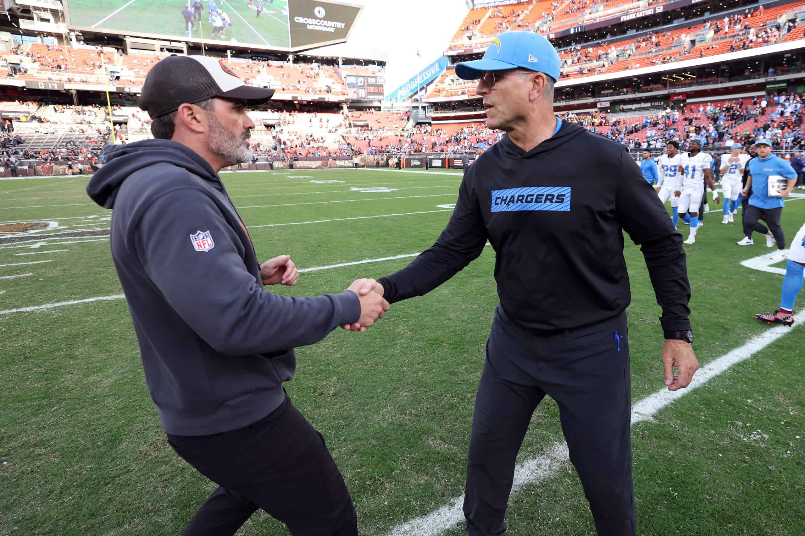 CLEVELAND, OHIO - NOVEMBER 03: Head coach Kevin Stefanski of the Cleveland Browns and head coach Jim Harbaugh of the Los Angeles Chargers shake hands after Los Angeles' 27-10 win at Huntington Bank Field on November 03, 2024 in Cleveland, Ohio.