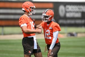 BEREA, OHIO - JUNE 04: Joe Flacco #15 and Shedeur Sanders #12 of the Cleveland Browns laugh during Cleveland Browns OTA offseason workouts at CrossCountry Mortgage Campus on June 04, 2025 in Berea, Ohio.