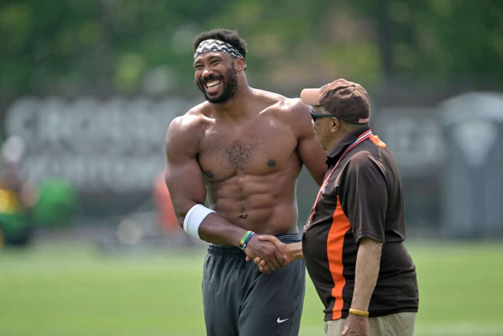 BEREA, OHIO - JUNE 12: Defensive end Myles Garrett #95 of the Cleveland Browns talks with a staff member during organized team activities at CrossCountry Mortgage Campus on June 12, 2025 in Berea, Ohio.