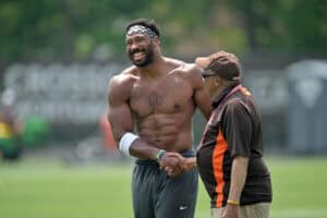 BEREA, OHIO - JUNE 12: Defensive end Myles Garrett #95 of the Cleveland Browns talks with a staff member during organized team activities at CrossCountry Mortgage Campus on June 12, 2025 in Berea, Ohio.