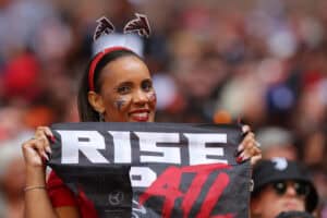 ATLANTA, GEORGIA - OCTOBER 02: An Atlanta Falcons fan smiles for a picture during the third quarter of the game against the Cleveland Browns at Mercedes-Benz Stadium on October 02, 2022 in Atlanta, Georgia.