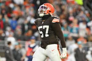 CLEVELAND, OHIO - DECEMBER 29: Isaiah McGuire #57 of the Cleveland Browns reacts during the second quarter against the Miami Dolphins at Huntington Bank Field on December 29, 2024 in Cleveland, Ohio.