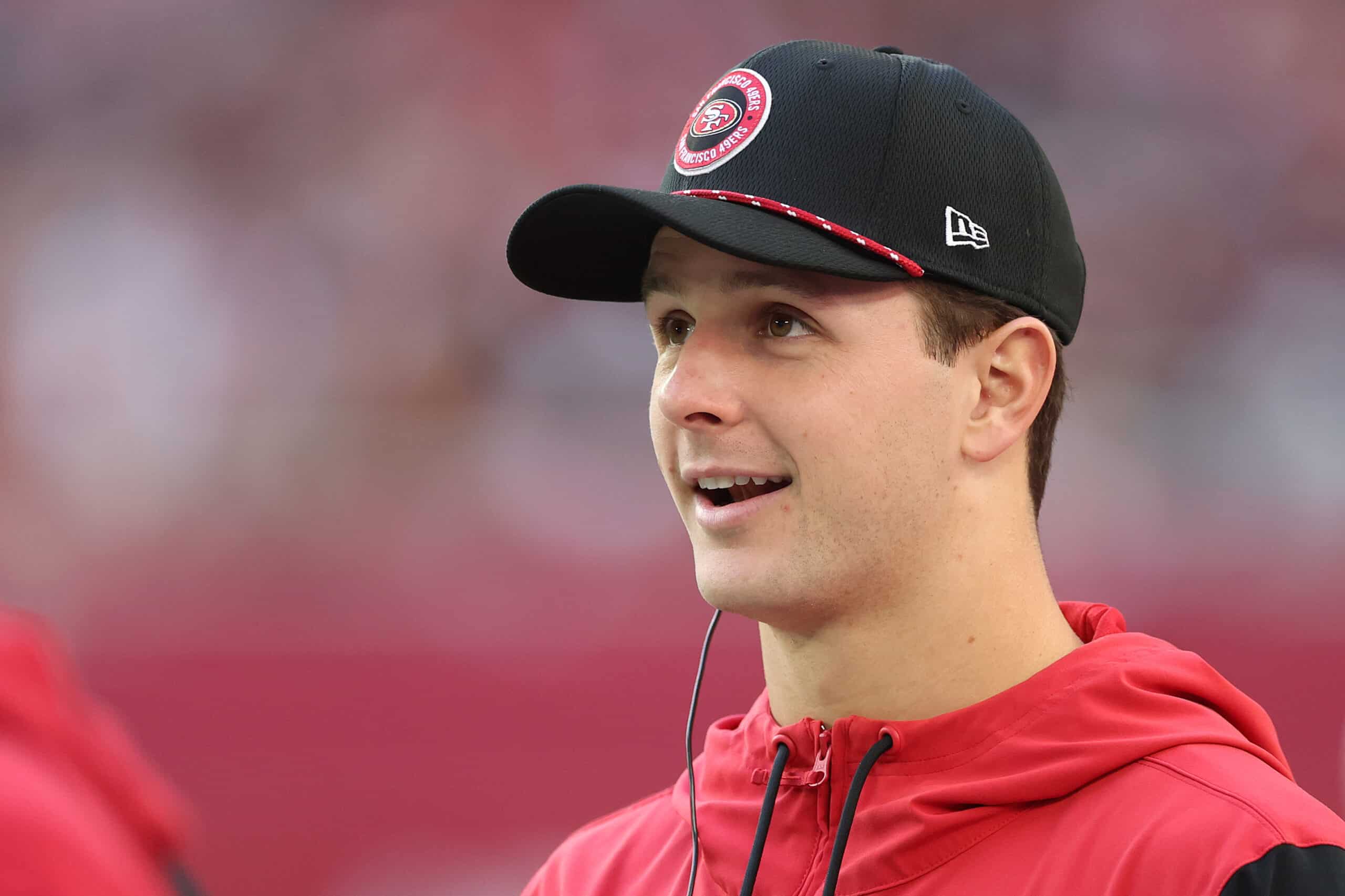 GLENDALE, ARIZONA - JANUARY 05: Brock Purdy #13 of the San Francisco 49ers looks on from the sidelines during the second quarter against the Arizona Cardinals at State Farm Stadium on January 05, 2025 in Glendale, Arizona.