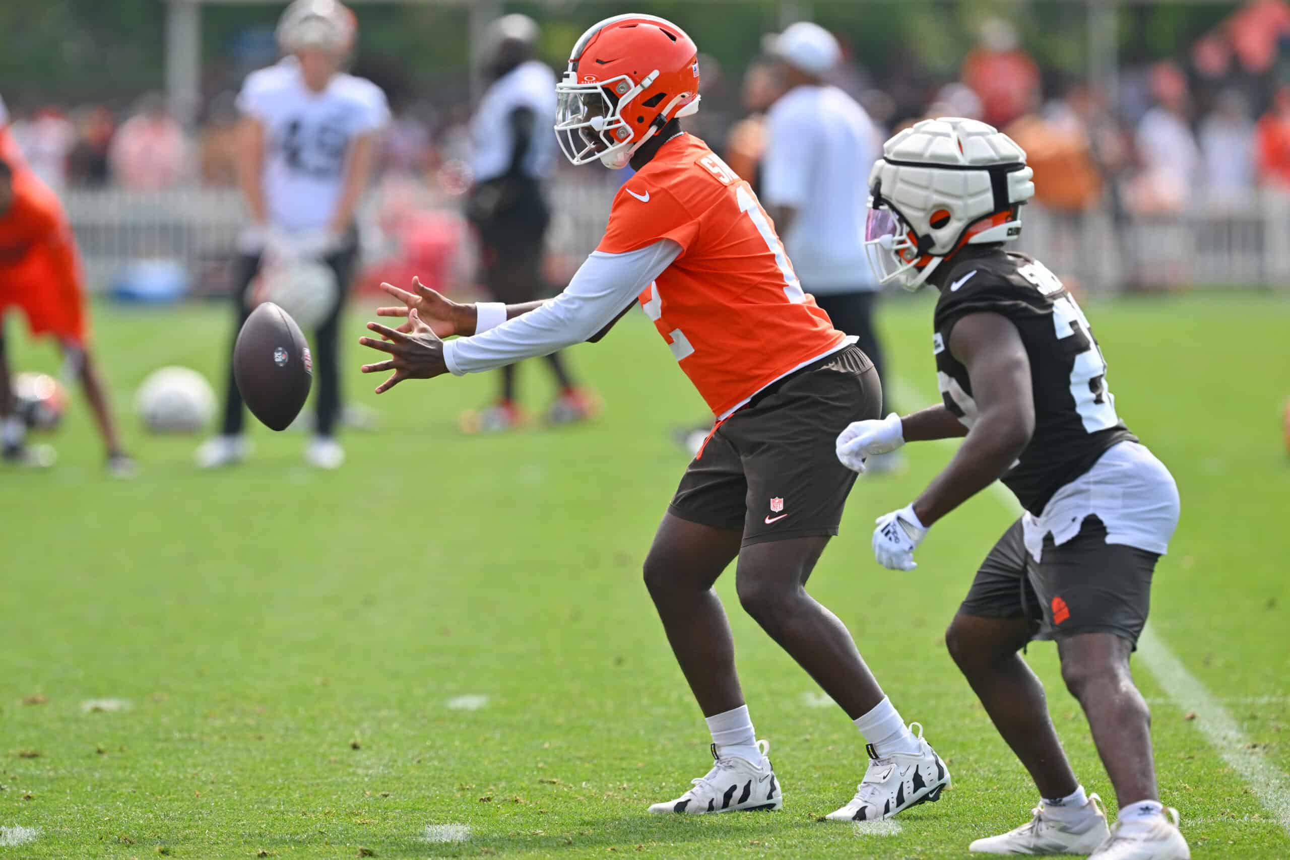 BEREA, OHIO - JULY 26: Quarterback Shedeur Sanders #12 of the Cleveland Browns takes a snap during training camp at CrossCountry Mortgage Campus on July 26, 2025 in Berea, Ohio.