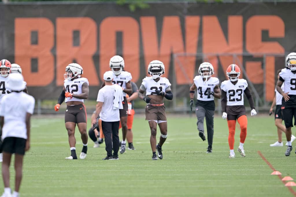 BEREA, OHIO - JULY 25: The Cleveland Browns defense warms up during training camp at CrossCountry Mortgage Campus on July 25, 2025 in Berea, Ohio.