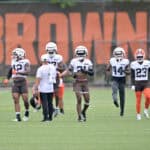 BEREA, OHIO - JULY 25: The Cleveland Browns defense warms up during training camp at CrossCountry Mortgage Campus on July 25, 2025 in Berea, Ohio.