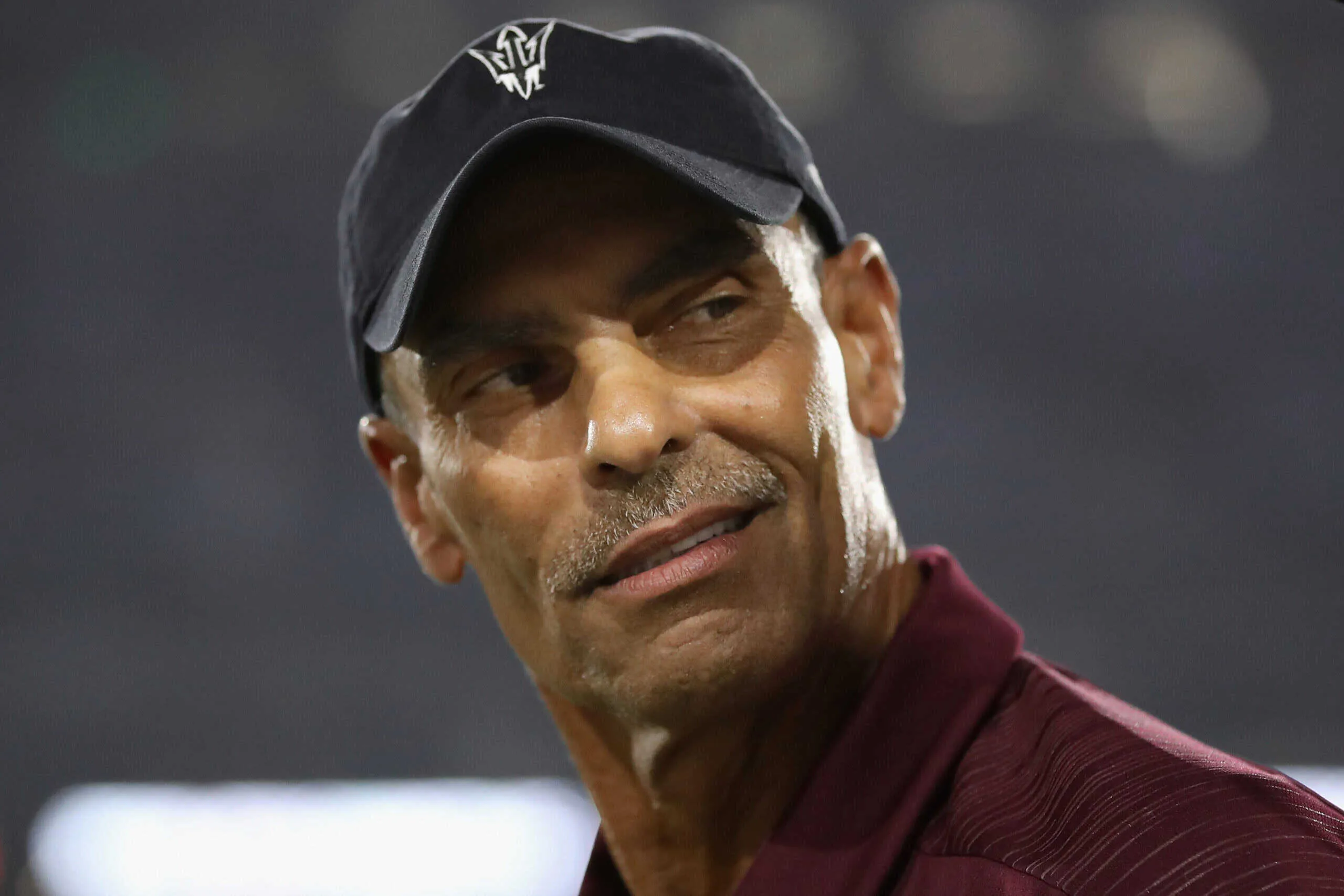 TEMPE, AZ - SEPTEMBER 08: Head coach Herm Edwards of the Arizona State Sun Devils watches warm ups to the college football game against the Michigan State Spartans at Sun Devil Stadium on September 8, 2018 in Tempe, Arizona.