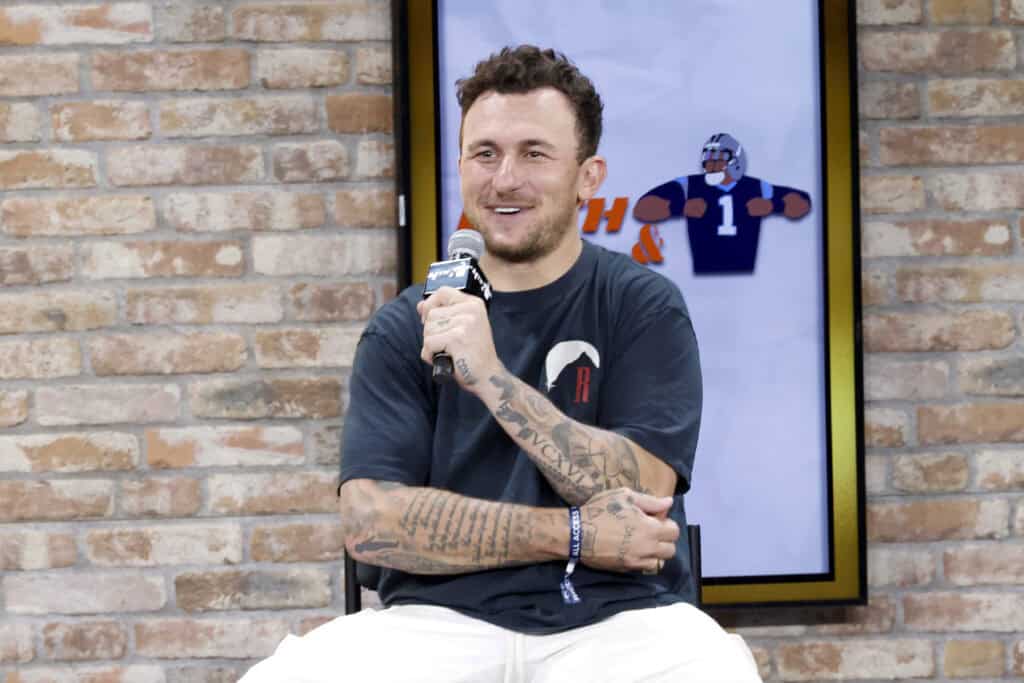 NEW YORK, NEW YORK - AUGUST 16: Johnny Manziel speaks onstage at the Fanatics Fest NYC 2024 at Jacob Javits Center on August 16, 2024 in New York City.