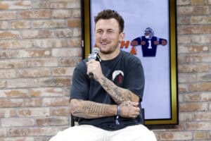 NEW YORK, NEW YORK - AUGUST 16: Johnny Manziel speaks onstage at the Fanatics Fest NYC 2024 at Jacob Javits Center on August 16, 2024 in New York City.