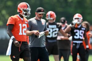 BEREA, OHIO - JUNE 11: Head coach Kevin Stefanski of the Cleveland Browns instructs Shedeur Sanders #12 during Cleveland Browns mandatory minicamp at CrossCountry Mortgage Campus on June 11, 2025 in Berea, Ohio.