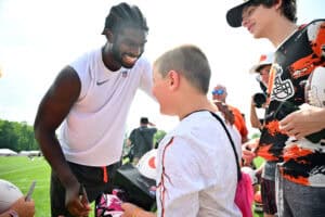 BEREA, OHIO - JULY 26: Quarterback Shedeur Sanders #12 of the Cleveland Browns signs autographs for young fans during training camp at CrossCountry Mortgage Campus on July 26, 2025 in Berea, Ohio.
