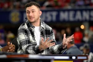 ATLANTA, GEORGIA - DECEMBER 03: Football Quarterback Johnny Manziel talks onset prior to the SEC Championship game between the LSU Tigers and the Georgia Bulldogs at Mercedes-Benz Stadium on December 03, 2022 in Atlanta, Georgia.