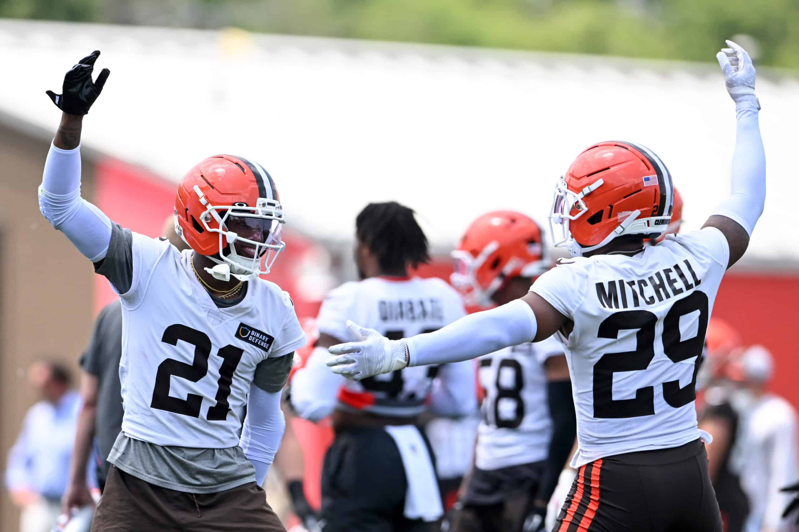 BEREA, OHIO - JUNE 04: Denzel Ward #21 and Cameron Mitchell #29 of the Cleveland Browns celebrate during Cleveland Browns OTA offseason workouts at CrossCountry Mortgage Campus on June 04, 2025 in Berea, Ohio.
