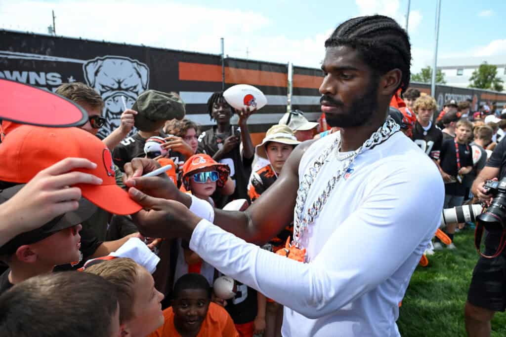 BEREA, OHIO - JULY 28: Shedeur Sanders #12 of the Cleveland Browns signs autographs after Cleveland Browns training camp at CrossCountry Mortgage Campus on July 28, 2025 in Berea, Ohio.